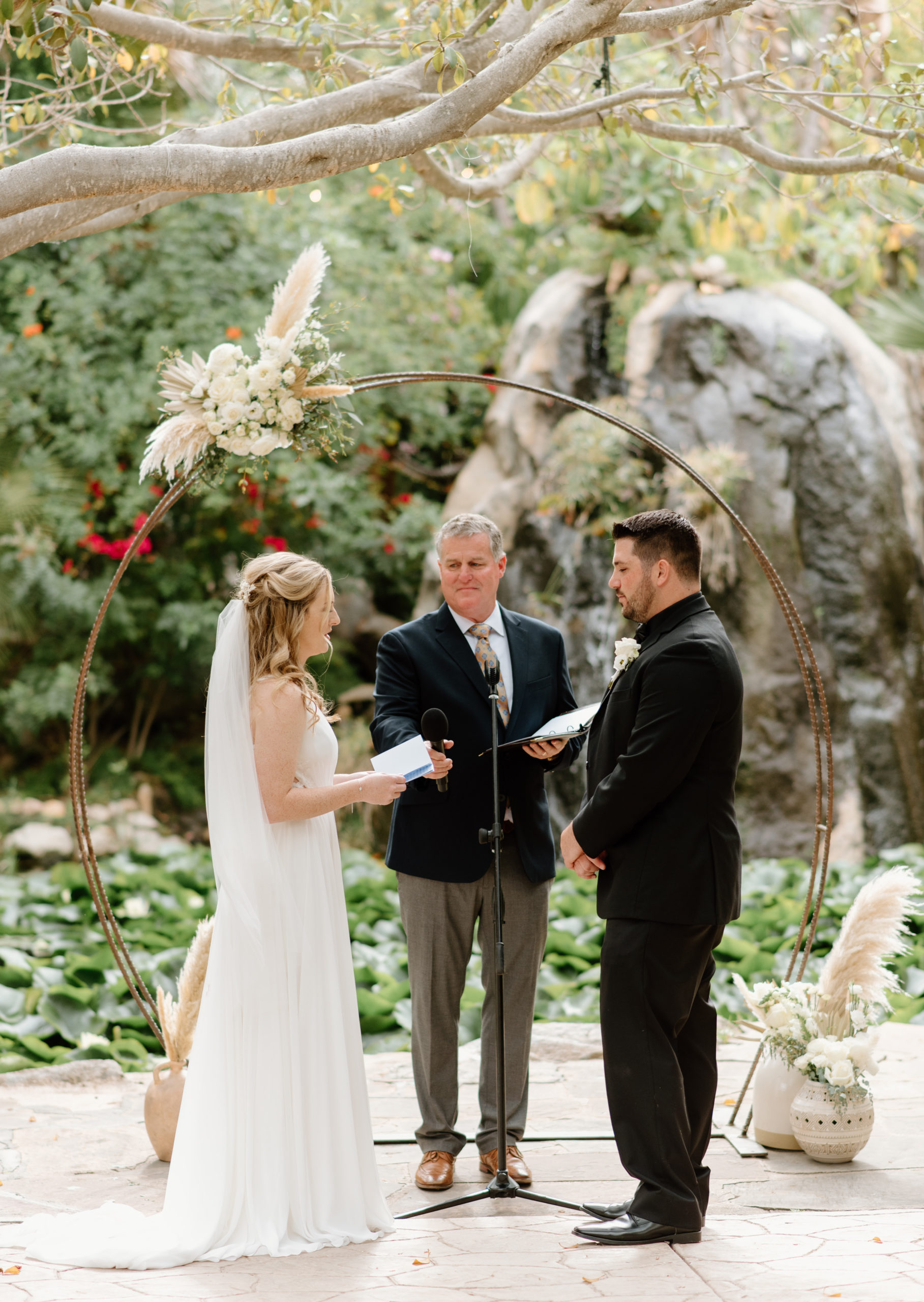 Brooke and Jayden saying their vows on their wedding day at the Botanica Oceanside