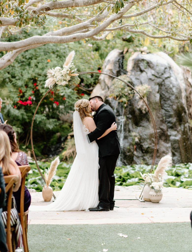 Bride and groom share their first kiss!