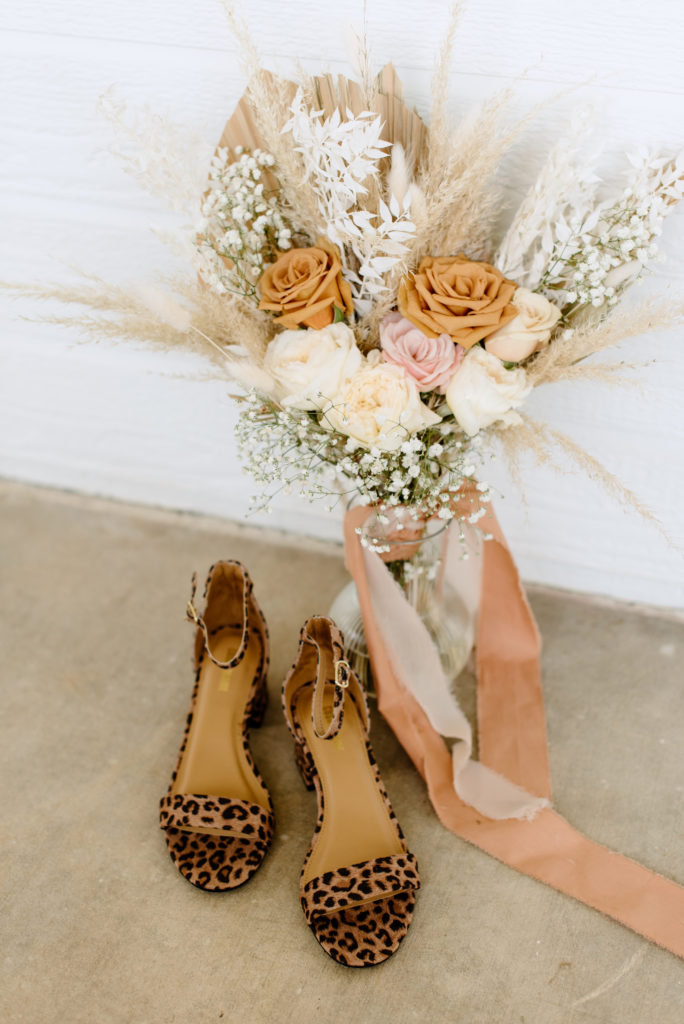 The bridal bouquet and the bride's heels for the Temecula backyard wedding