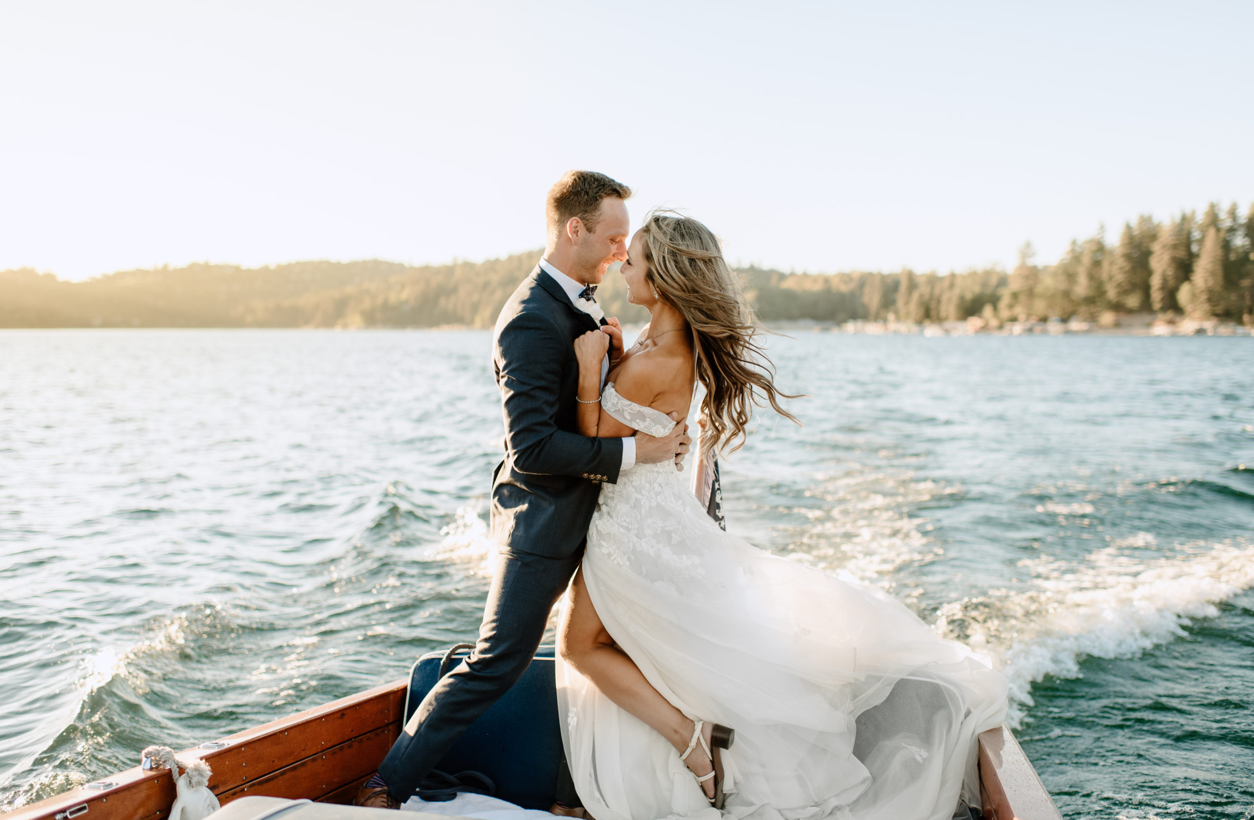Bride and groom portraits in a boat on Lake Arrowhead