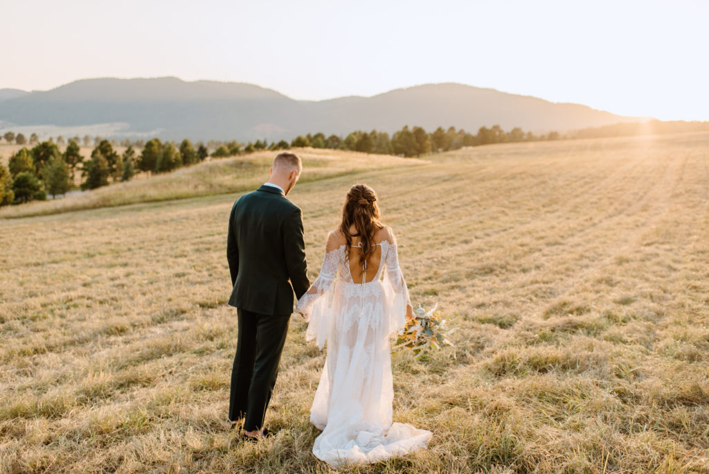 Bride and groom portraits outside around Spruce Mountain Ranch