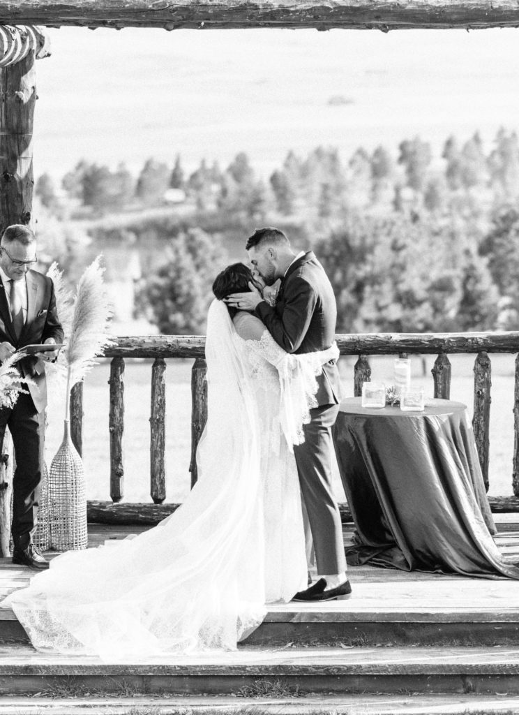 The bride and groom share their first kiss as a married couple