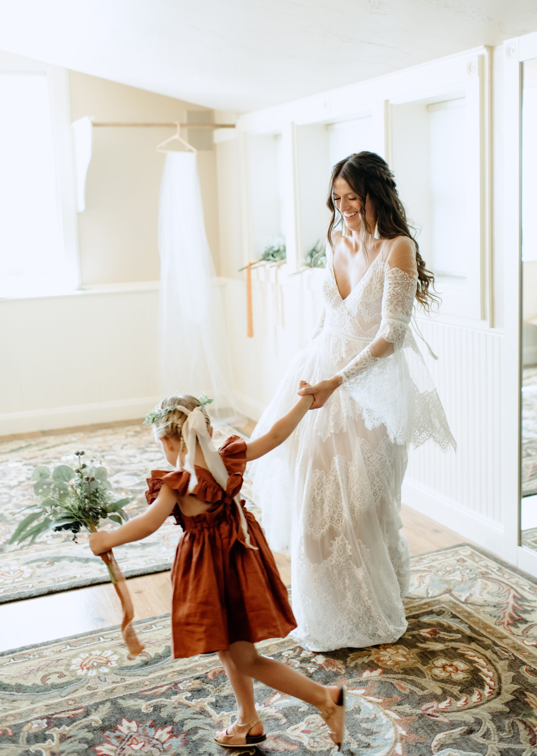 The bride and the flower girl before the Spruce Mountain Ranch wedding ceremony 