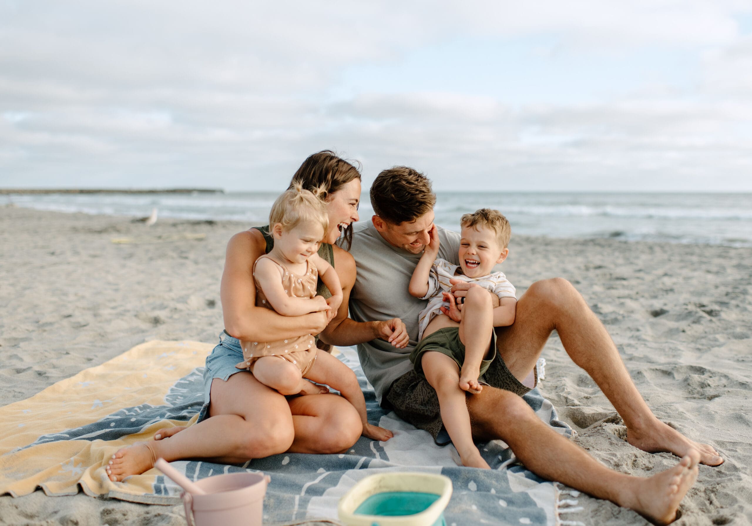 As an Oceanside Family Photographer, I love capturing the laughter between families