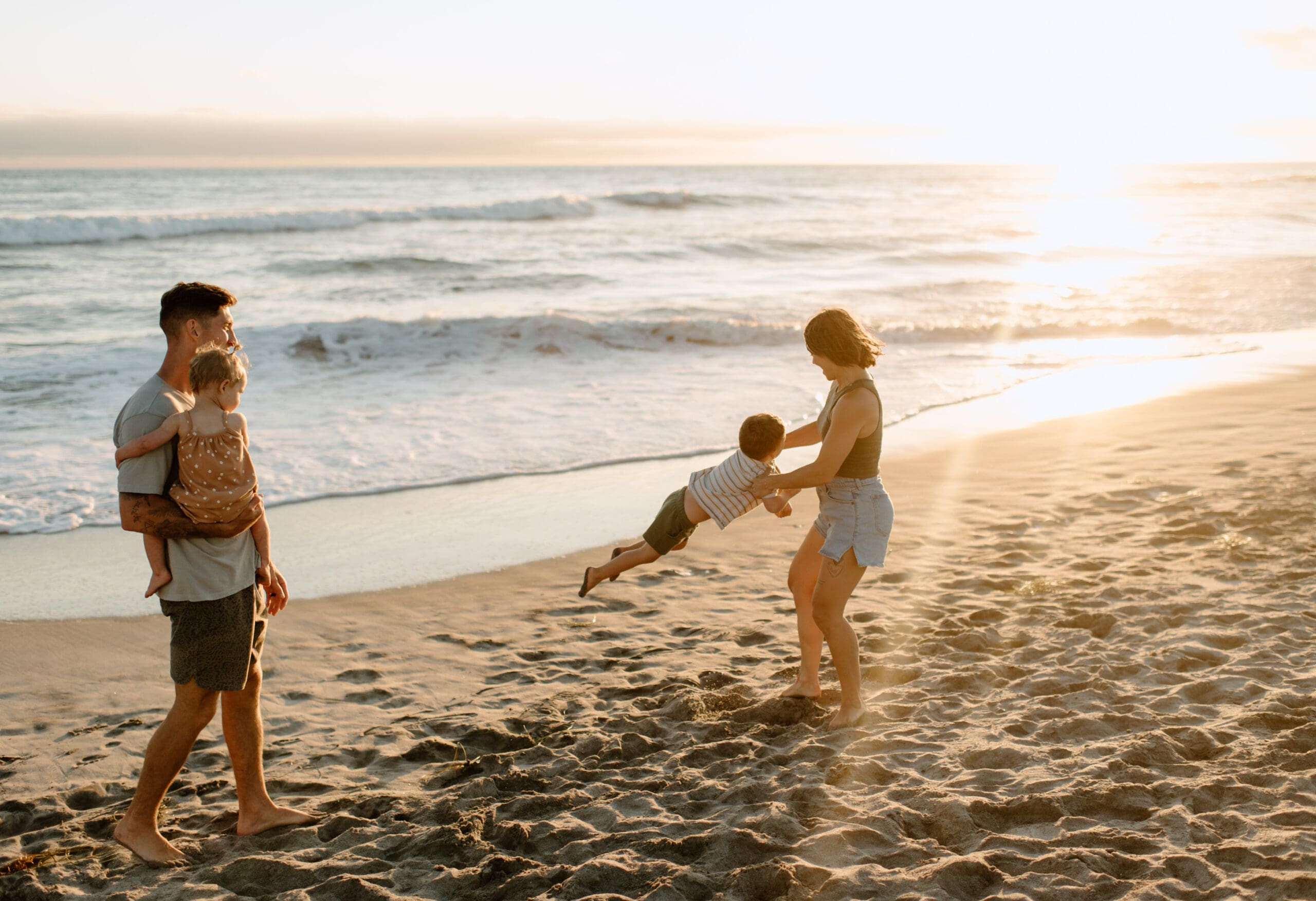 Family playing on the beach in Oceanside California