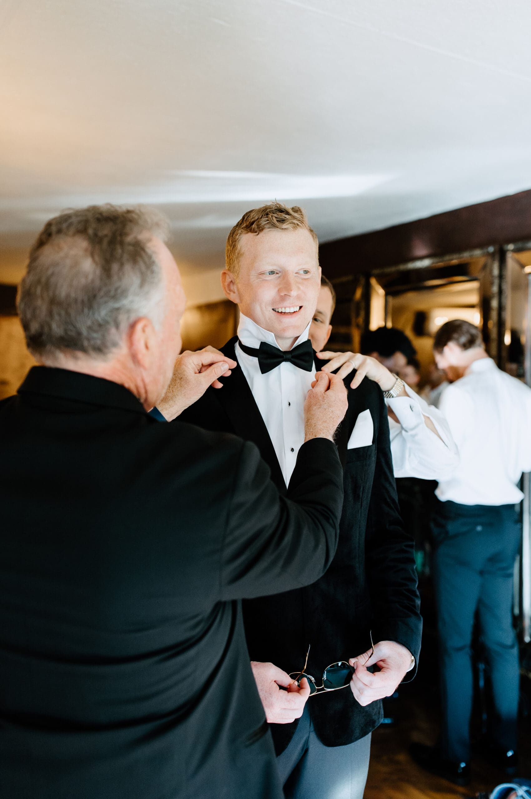 Groom getting ready for his wedding day inside Tivoli Italian Villa