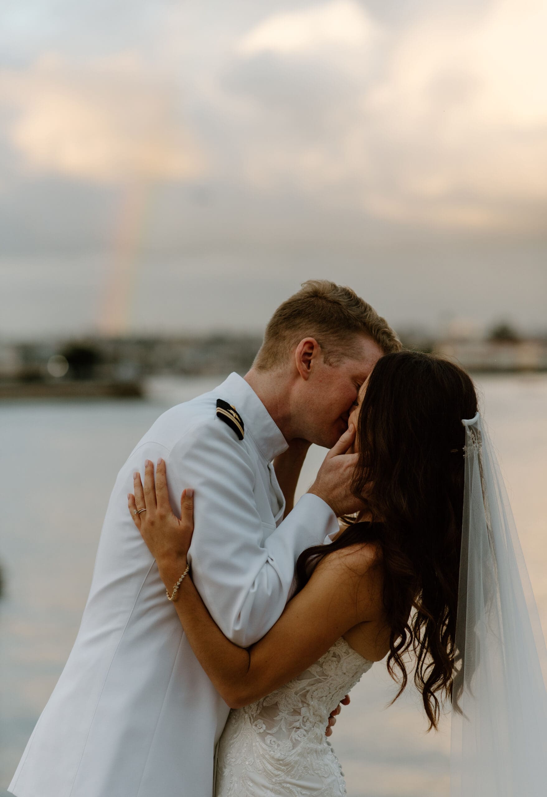 The bride and groom kissing during portraits