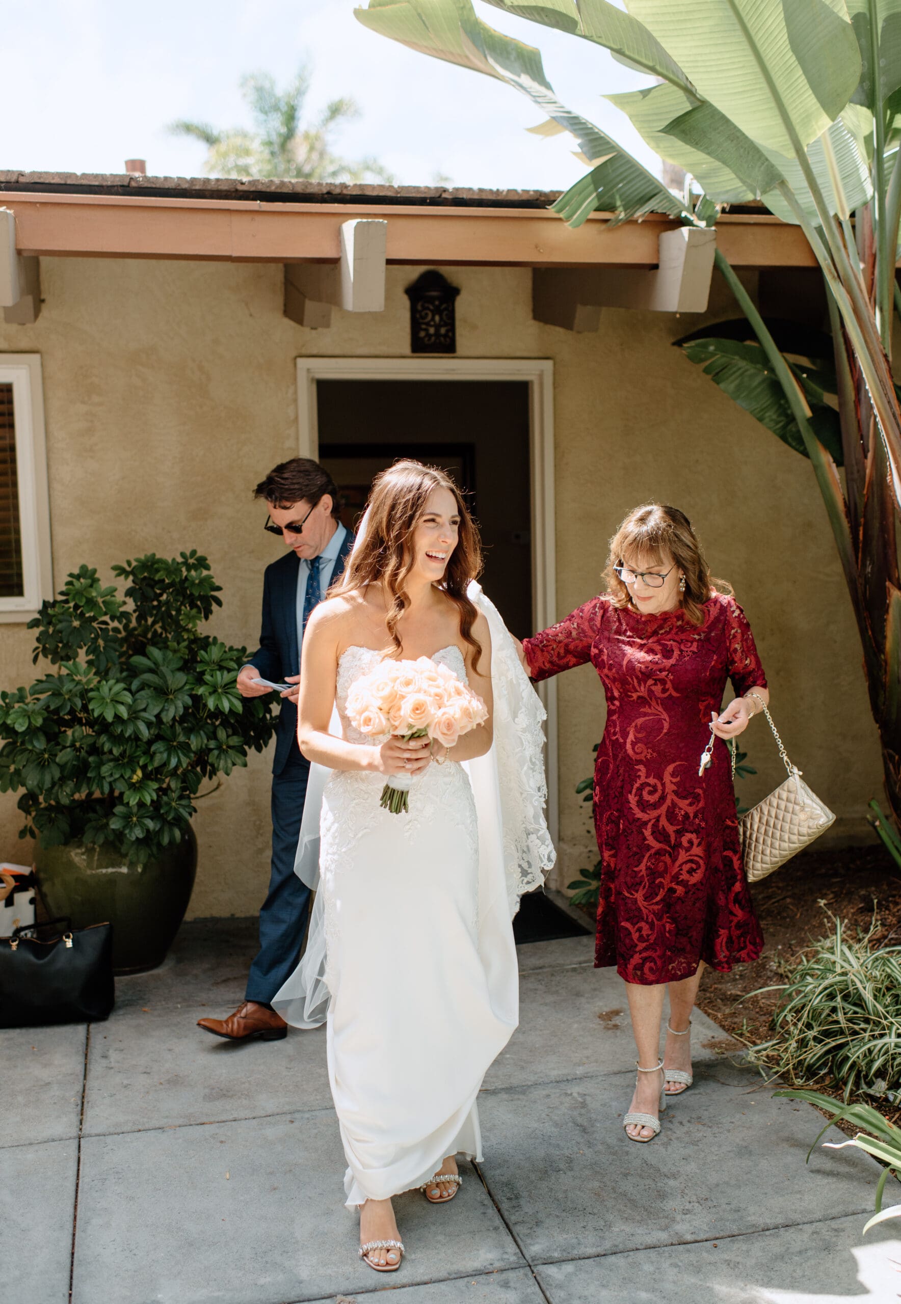 The bride and her mother walking together after getting ready 