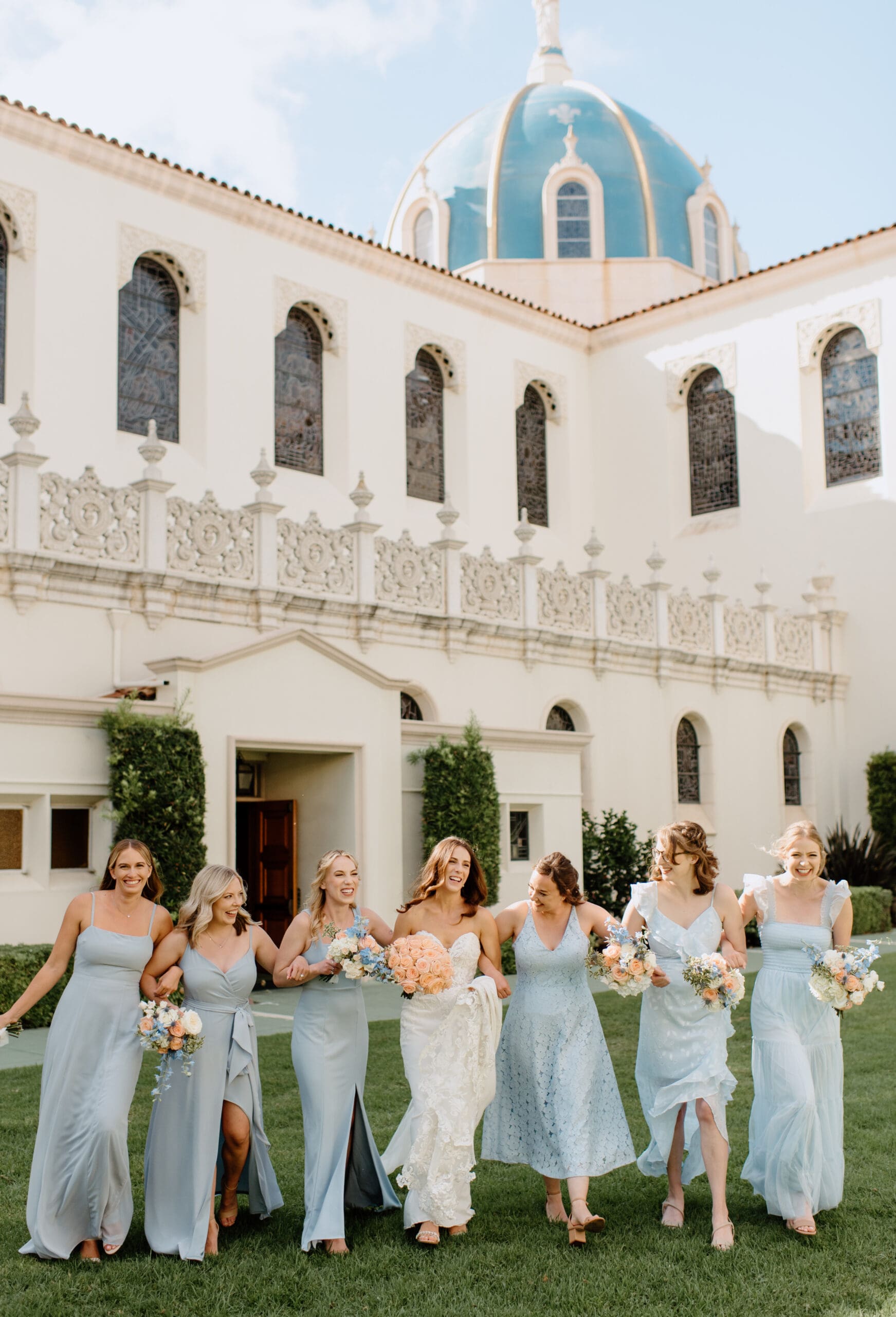 The bridesmaids walking with the bride at her Bali Hai Wedding