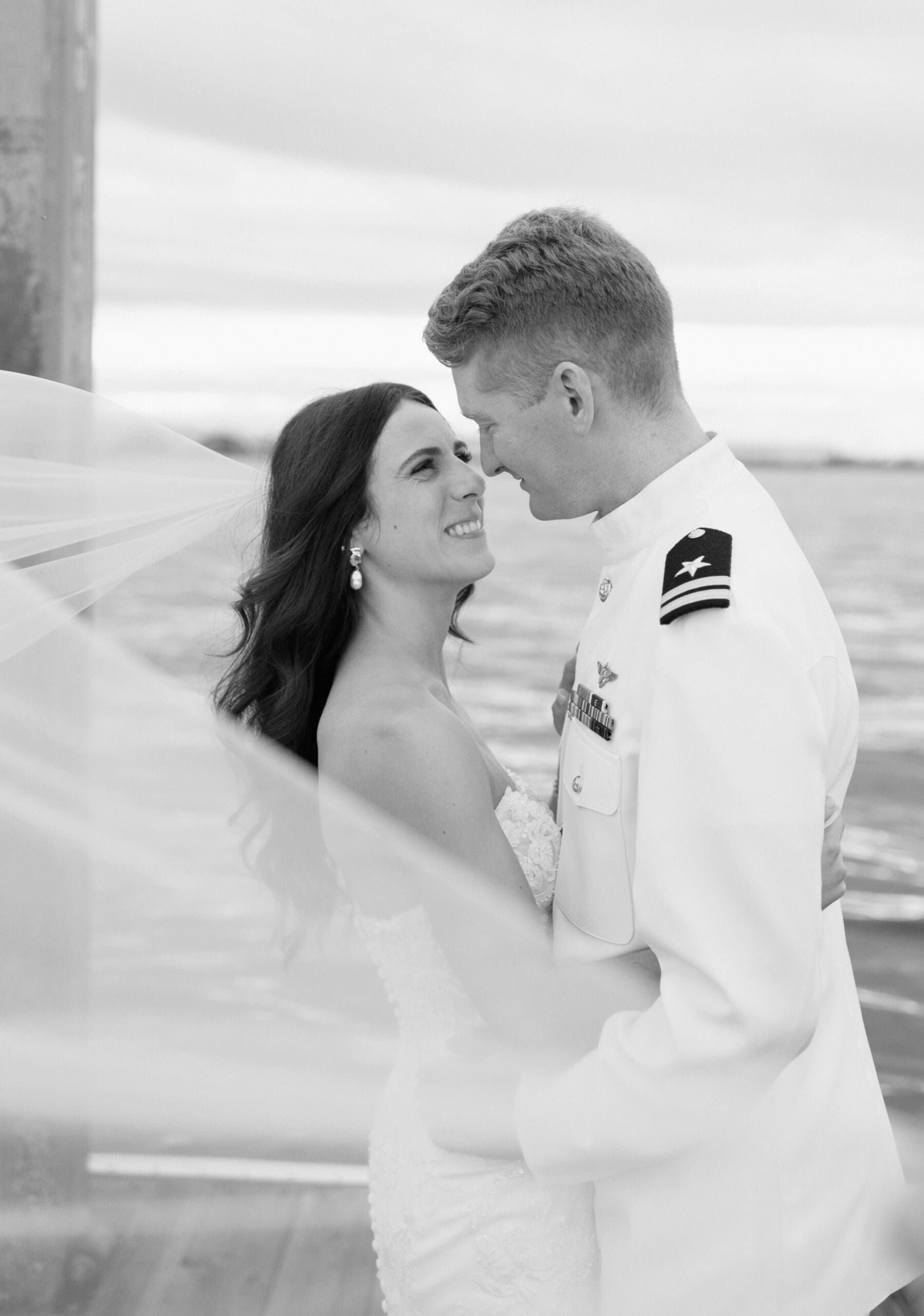 The bride and groom looking into each other's eyes during portraits