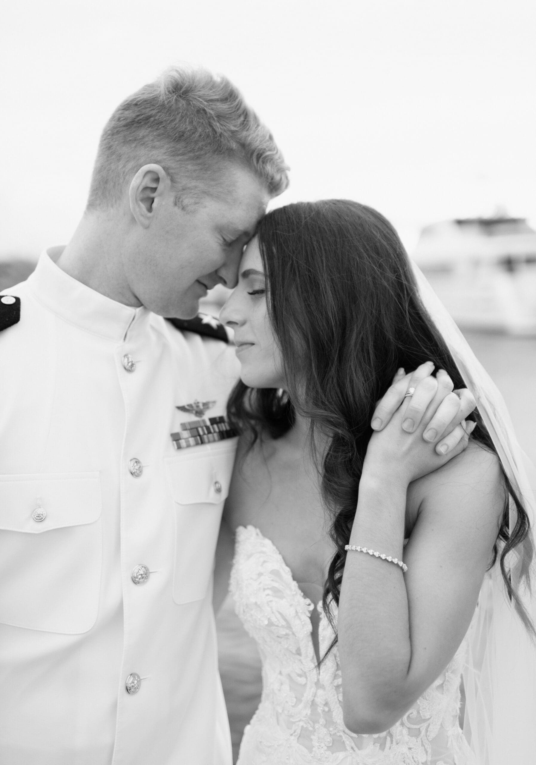 The bride and groom holding each other during portraits